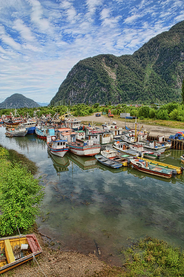Nature Photograph - Traditional Chilean Boats Docked Along the River in Carretera Austral, Chile by Stephanie Millner