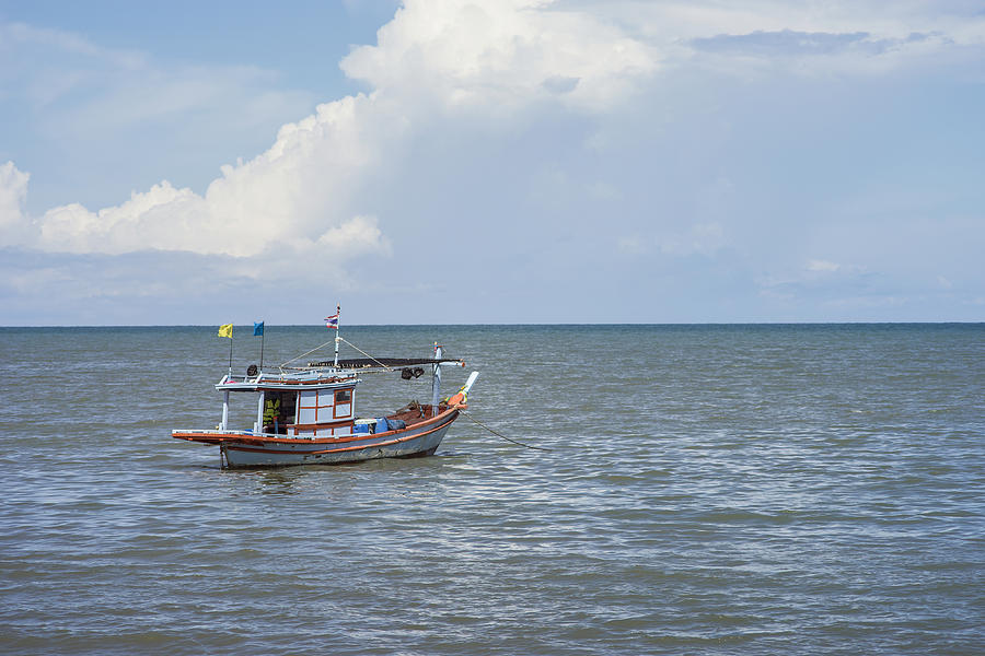 Traditional Fishing Boat Laying Alone On The Sea,selective Photograph by IttoIlmatar