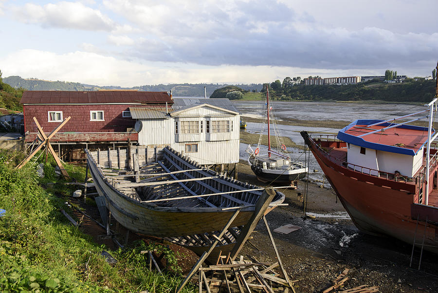 Traditional wooden boat repairing at Castro, Chiloe island, Chile Photograph by Feifei Cui-Paoluzzo