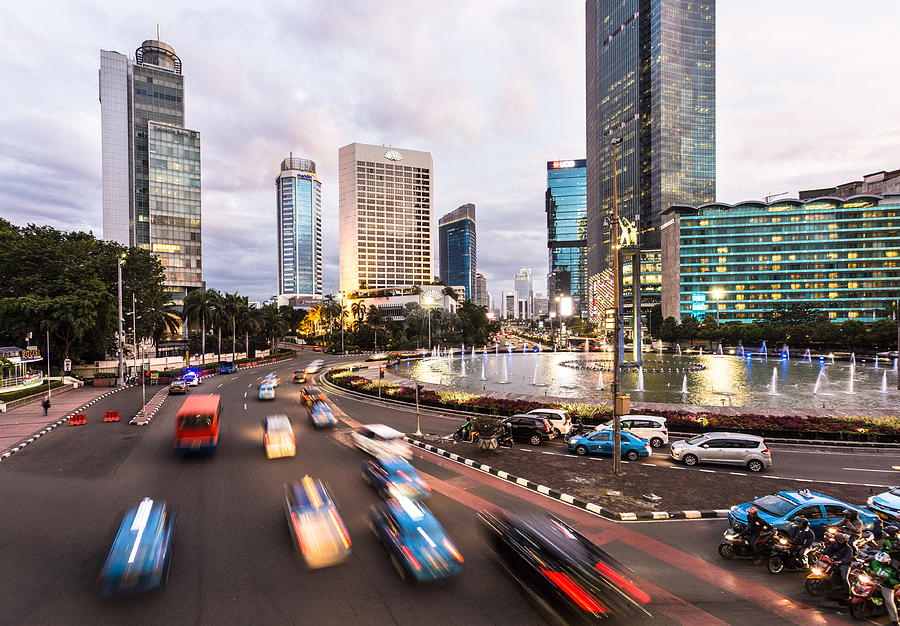 Traffic in Jakarta modern business district at sunset in Indonesia Photograph by @ Didier Marti