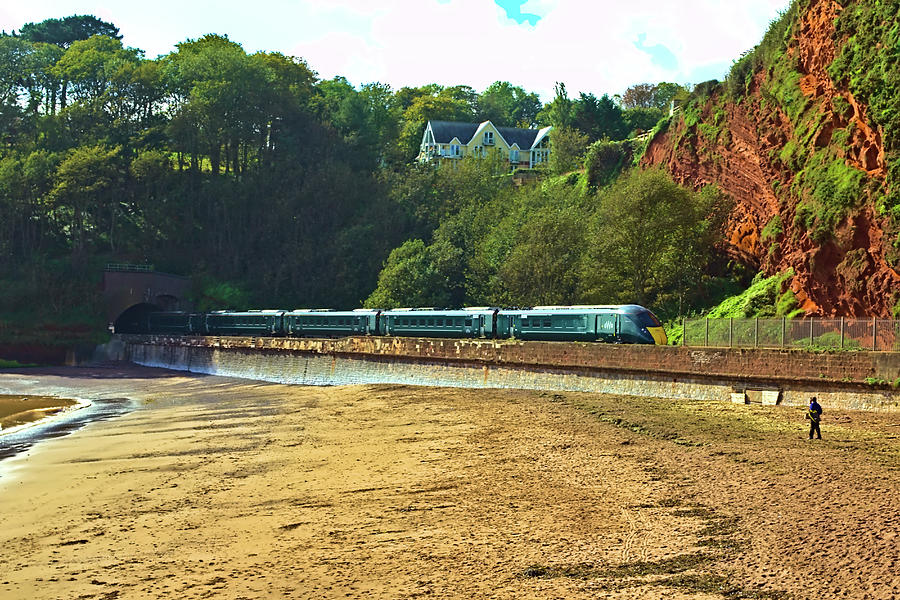 Train Heading to Dawlish from Teignmouth Photograph by Jeremy Hayden