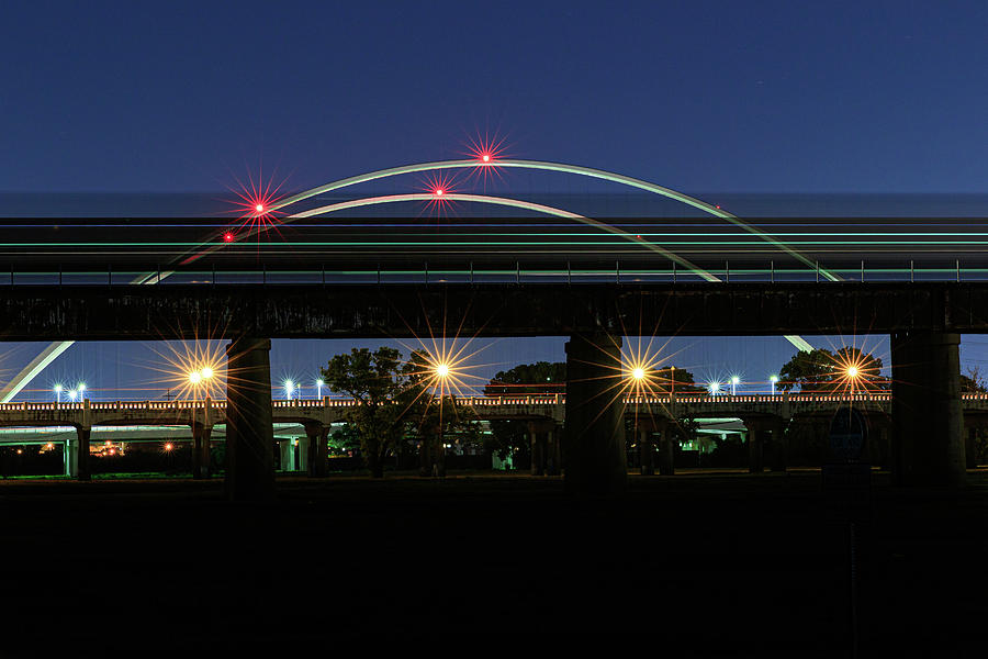 Train light trails on the Margaret McDermott bridge in ...