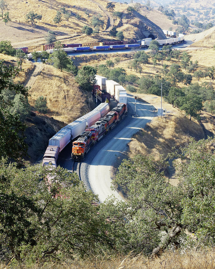 Trains That Pass in the Day -- Two Freight Trains in the Tehachapi Mountains, California Photograph by Darin Volpe