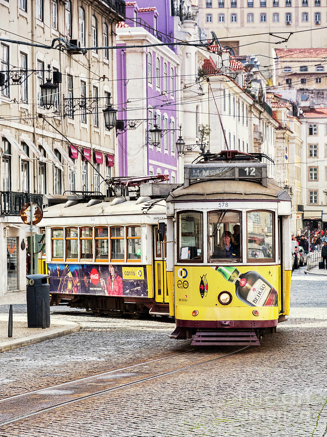 Trams Rounding a Corner into Figueira Square Lisbon Portugal Photograph by Colin and Linda McKie