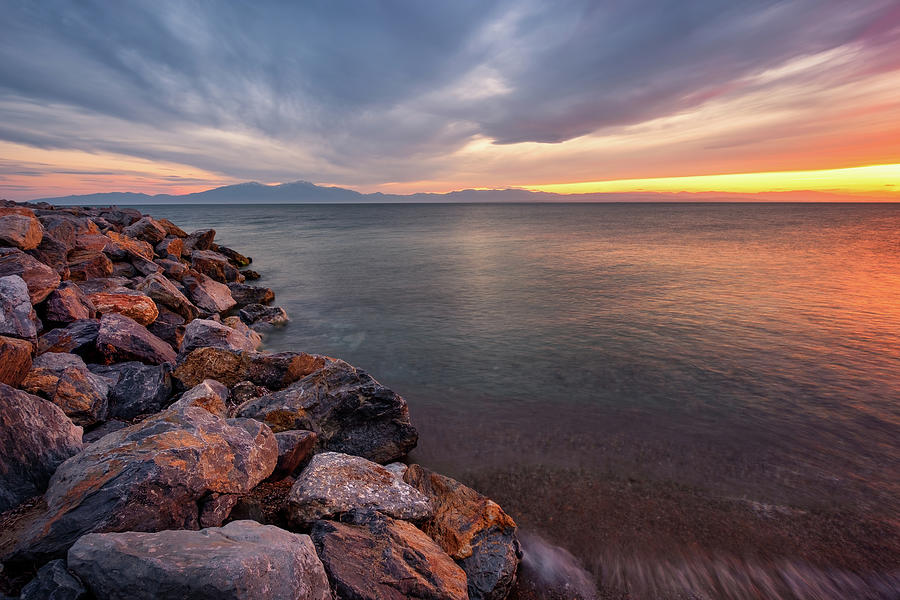 Tranquil Seascape With A Breakwater At Sunset Photograph by Alexios Ntounas