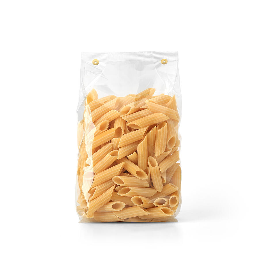 Transparent plastic pasta bag isolated on white background. Photograph by Goolyash