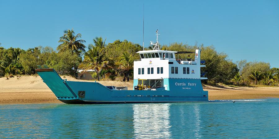 Transporter Ferry delivering goods to a tropical island sandy be Photograph by Geoff Childs