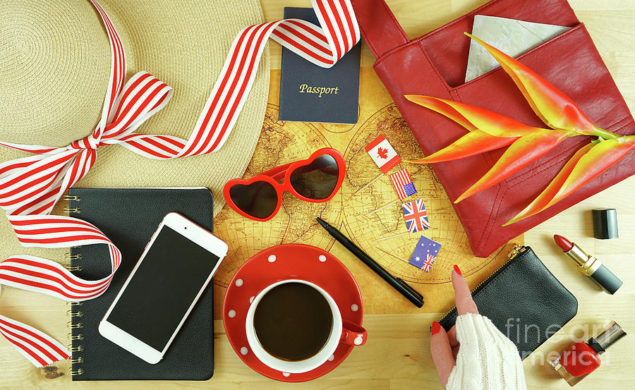 Travel concept planning with accessories and old pre-1900 map of the world. Photograph by Milleflore Images