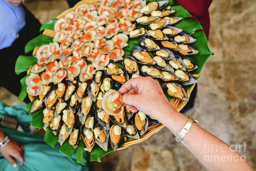 Tray of cooked mussels with spices served at a gastronomic party Photograph by Joaquin Corbalan