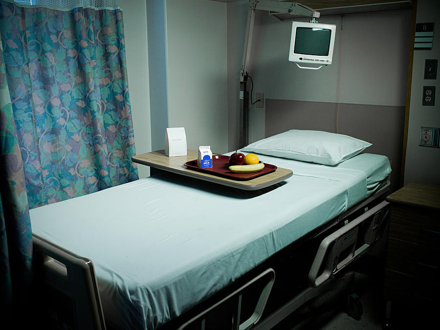 Tray of food on hospital bed Photograph by Image Source