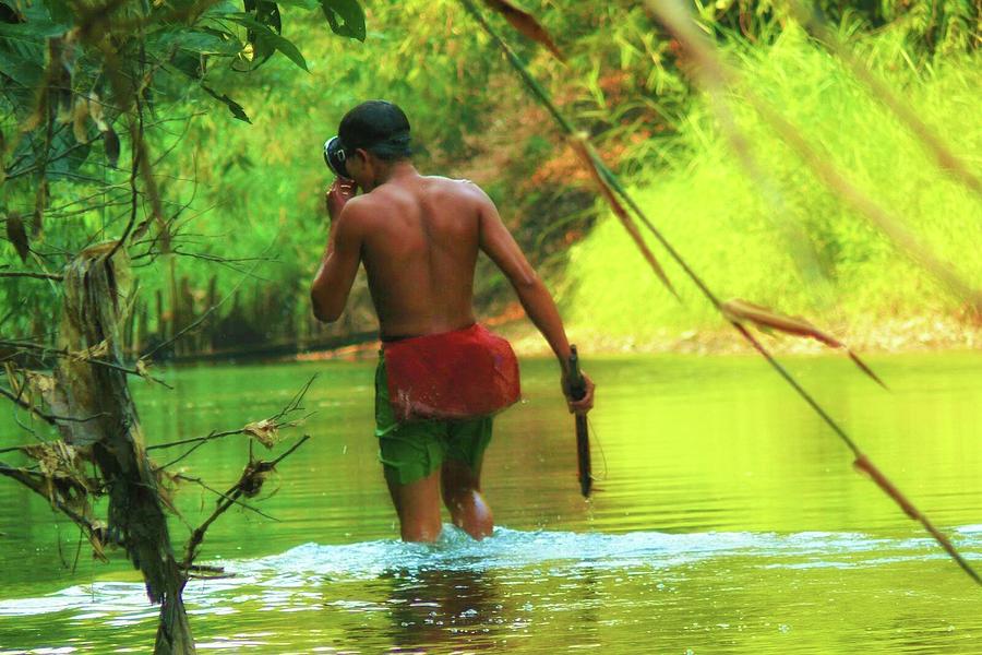 Tribal man goes fishing Photograph by Robert Bociaga