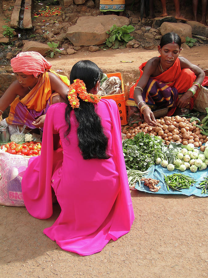 Tribal woman sells vegetables  in weekly market  Photograph by Steve Estvanik