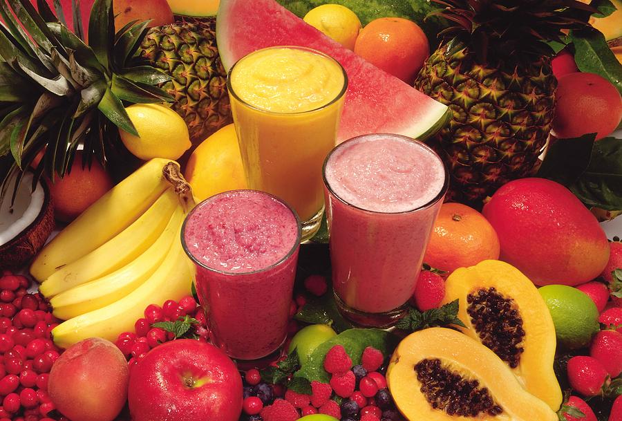 Tropical fruit smoothies Photograph by Jupiterimages