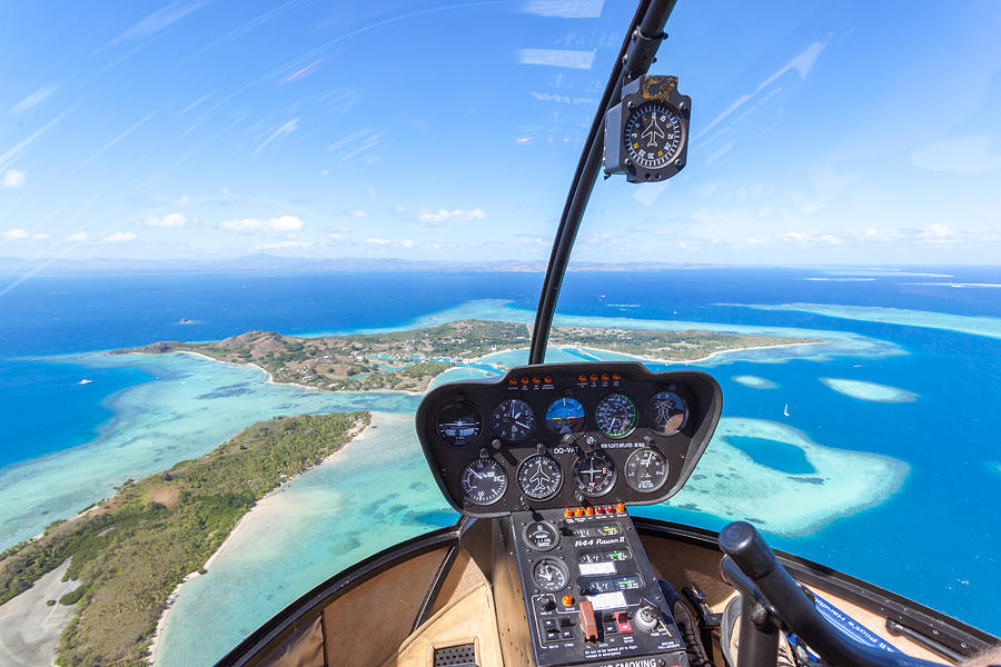 Tropical island seen from helicopter cockpit, Fiji Photograph by Matteo Colombo