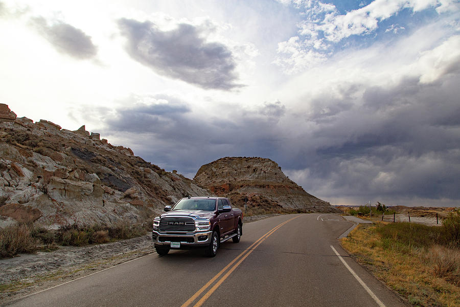 Truck on road at Theodore Roosevelt National Park in North Dakota Photograph by Eldon McGraw