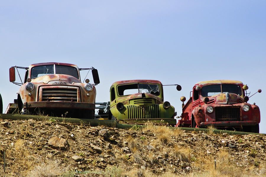 Trucks Lined Up On A Hill Photograph