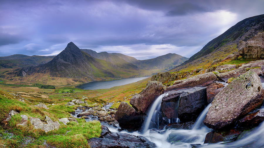 Tryfan in spring with the Afon Lloer in flow over the waterfalls ...