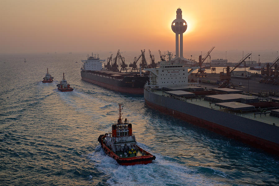 Tugs and freighter boats, Jeddah Harbor, Saudi Arabia Photograph by Alex Saurel