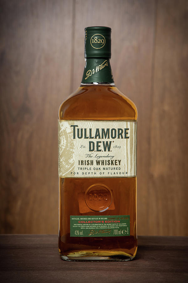 Tullamore Dew Whiskey Bottle On Wooden Background. Photograph