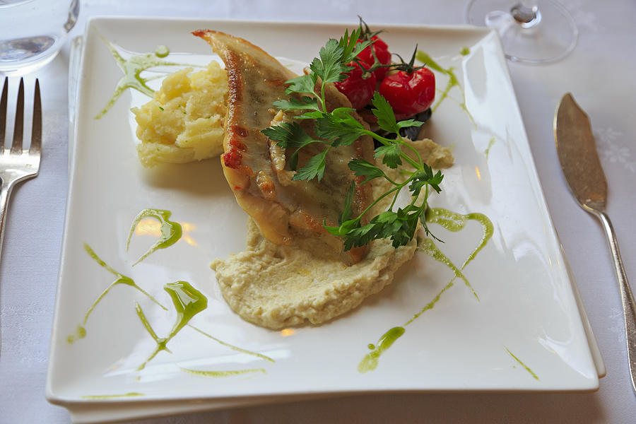 Turbot with mash and tomatoes Photograph by Louise Heusinkveld
