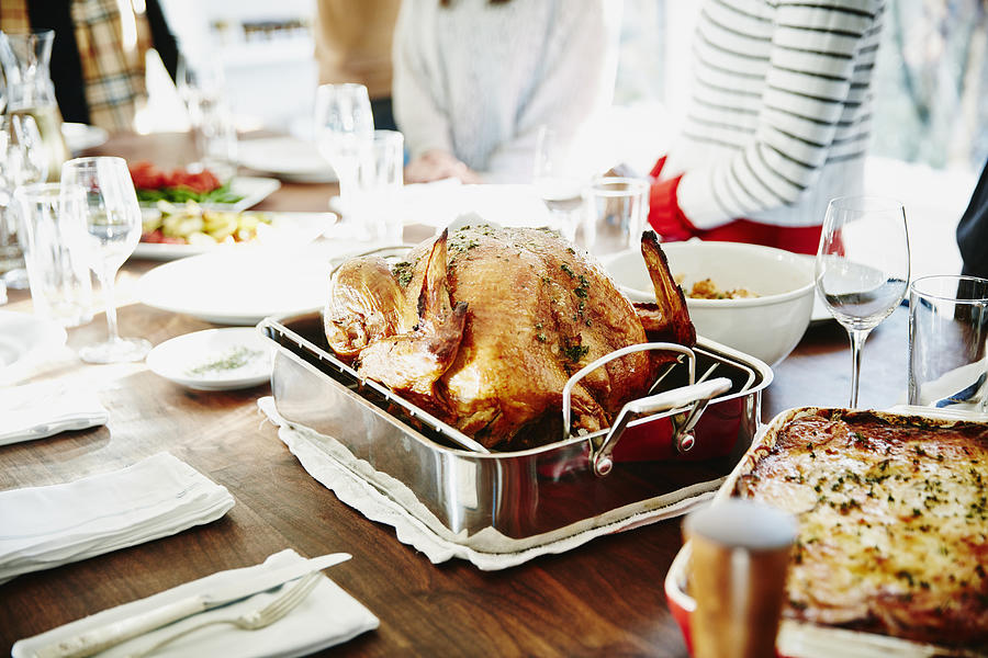 Turkey in roasting pan on table for holiday meal Photograph by Thomas Barwick