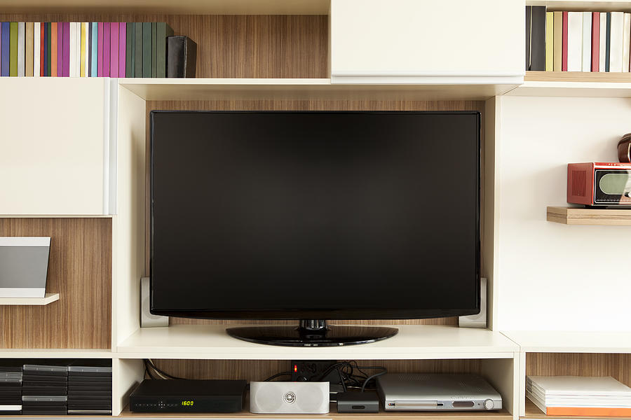 TV set on wall unit Photograph by Yurdakul