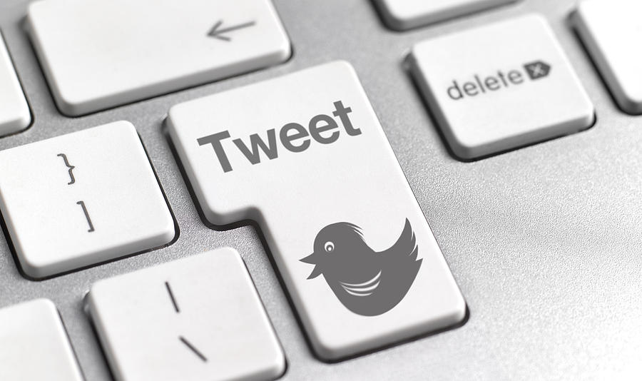 Tweet button on keyboard Photograph by Peter Dazeley