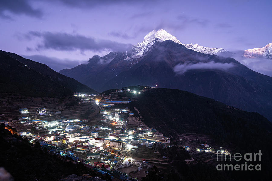 Twilight over the famous Namche Bazaar village in the Himalaya i Photograph by Didier Marti