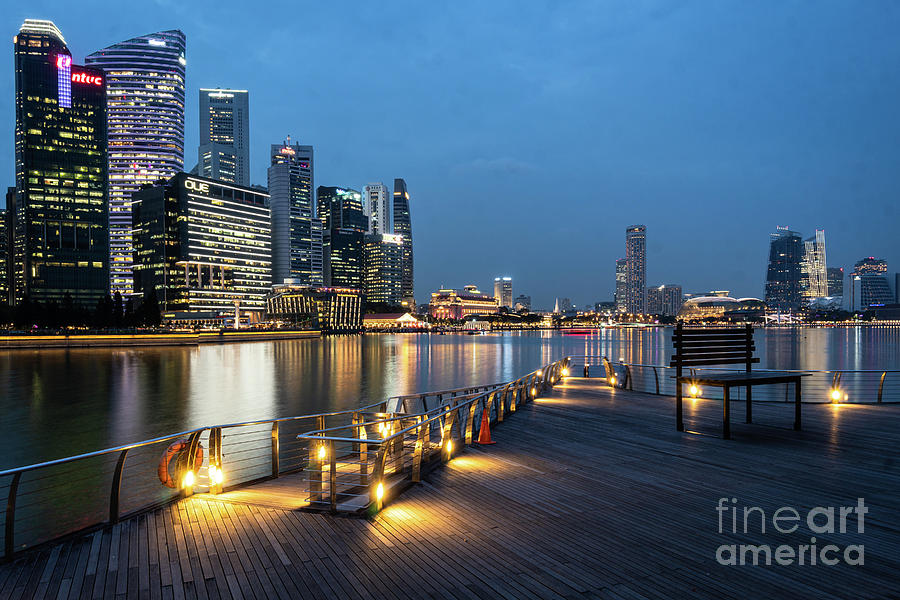 Twilight over the famous Singapore business district skyline by  Photograph by Didier Marti