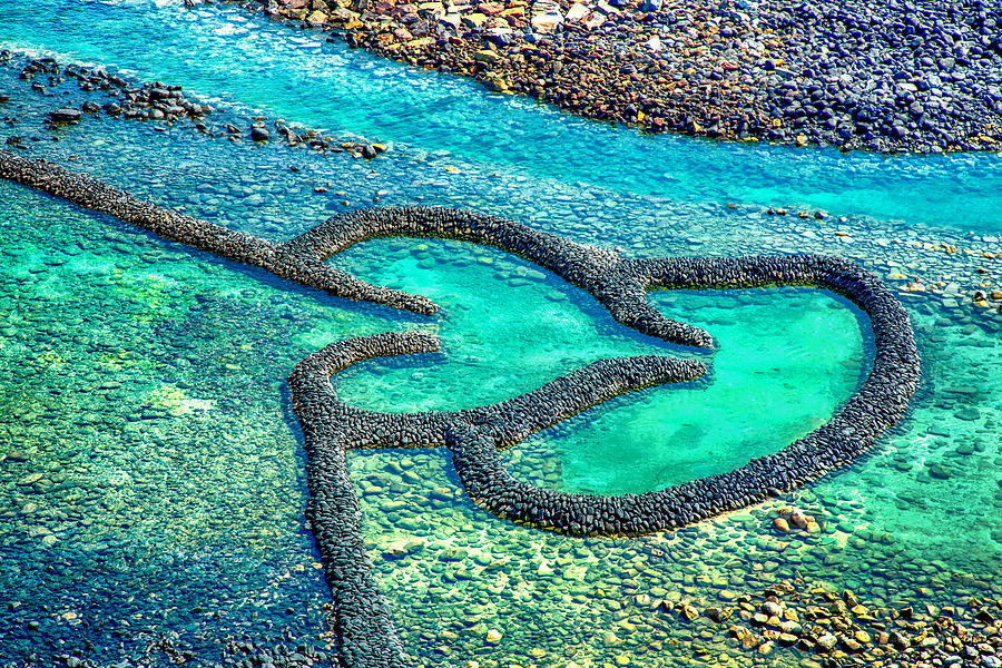 Twin-Hearts Stone Weir in Penghu Beach, Taiwan Photograph by GoranQ