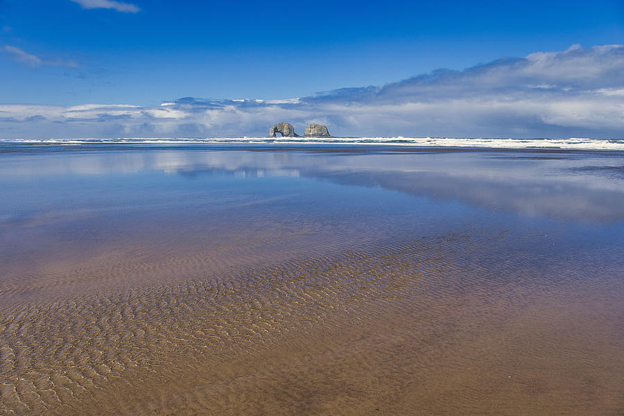 Twin Rocks glassy sea Photograph by Lynn Hopwood