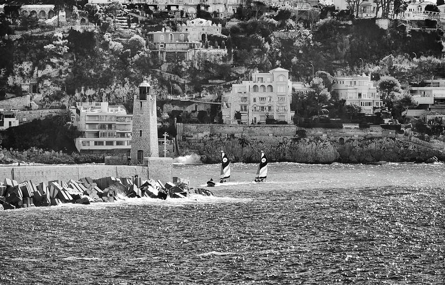 Twin Sailboats and Breakwater Lighthouse Nice Harbor French Riviera Black and White Photograph by Shawn OBrien