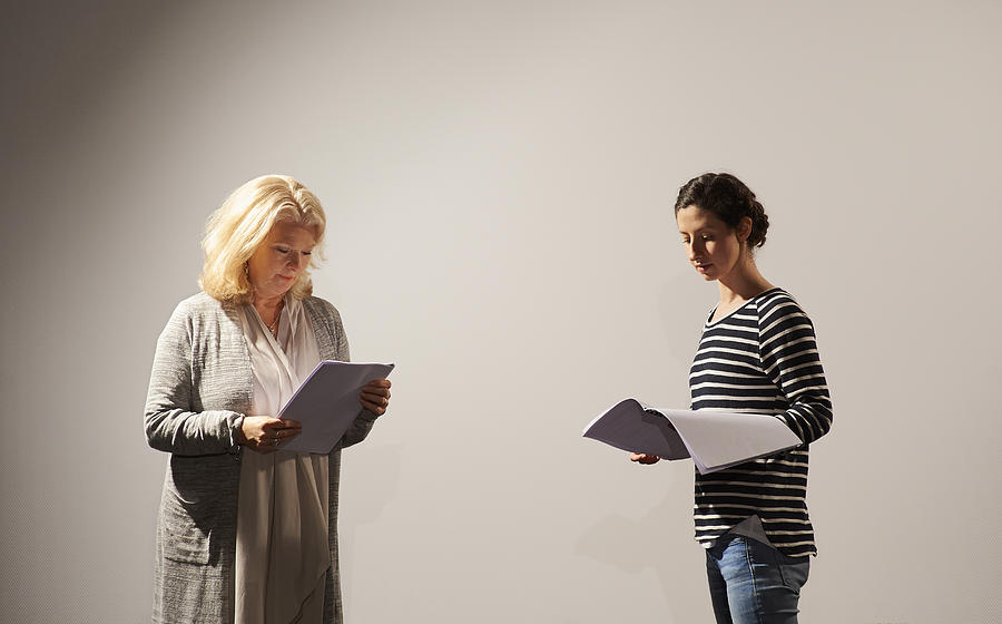 Two actresses rehearsing script. Photograph by Dougal Waters