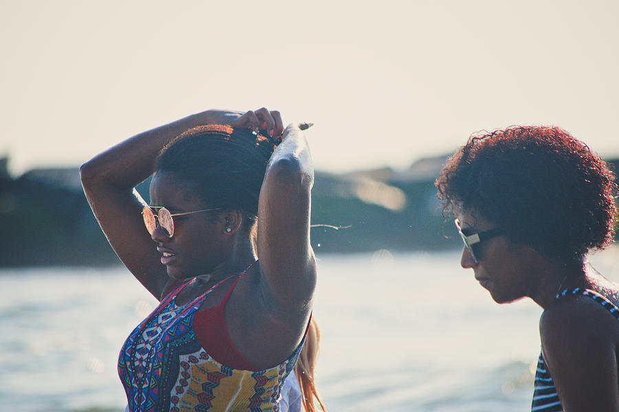 Two African American women at the beach. Photograph by Fran Polito
