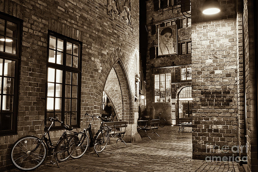 Two Bikes In The Alley In Sepia Photograph