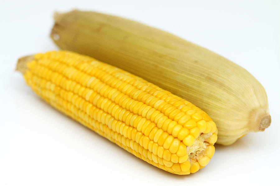 Two Boiled Corn Cob With Yellow Leaves Photograph by Akwitps