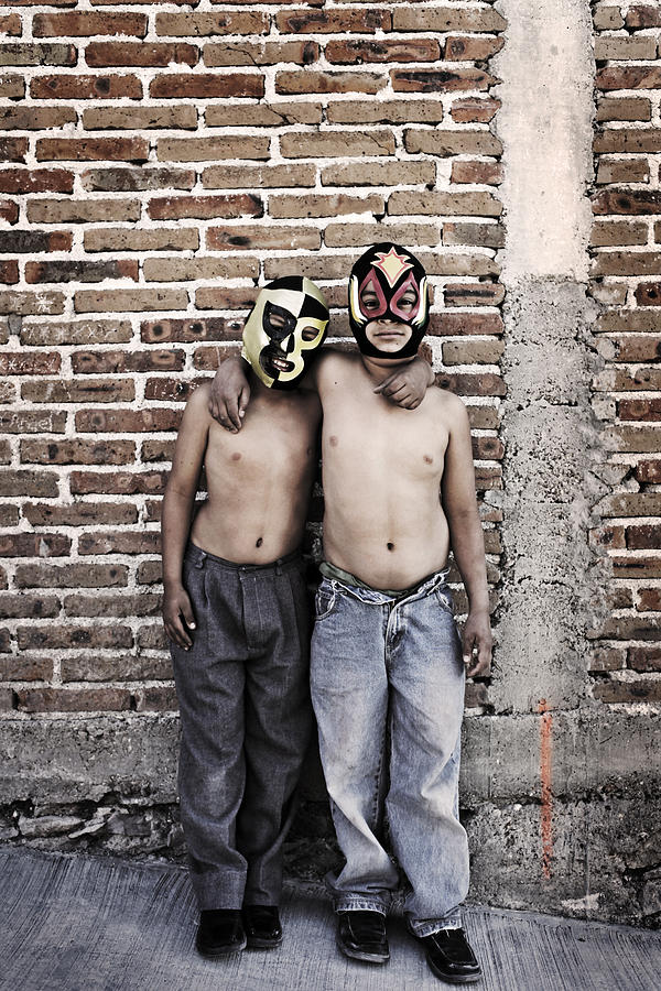 Two boys wearing Mexican  wrestling masks Photograph by Russell Monk
