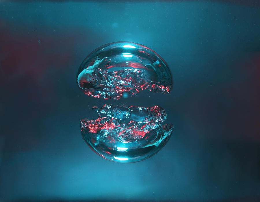 Two bubbles of air, blue and red, forming two halves of a sphere Photograph by Stanislaw Pytel