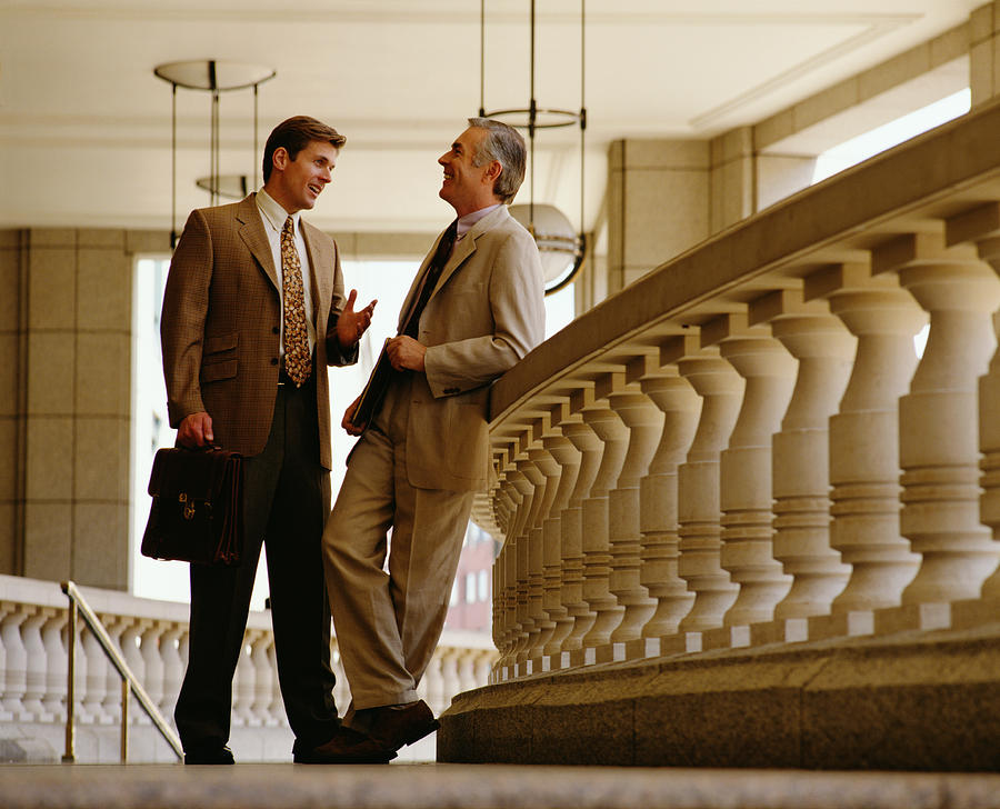 Two Businessmen Having A Chat Photograph by Bavaria.