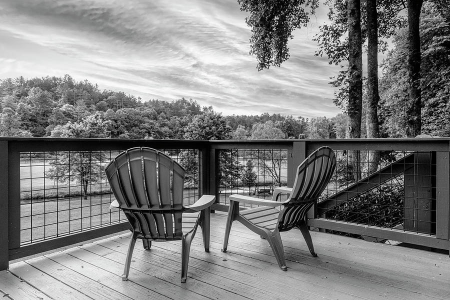 Two Chairs on the Cabin Porch Black and White Photograph by Debra and Dave Vanderlaan