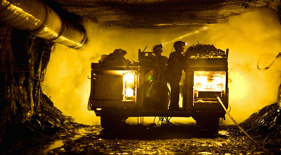 Two coal miners in mine shaft Photograph by Tyler Stableford