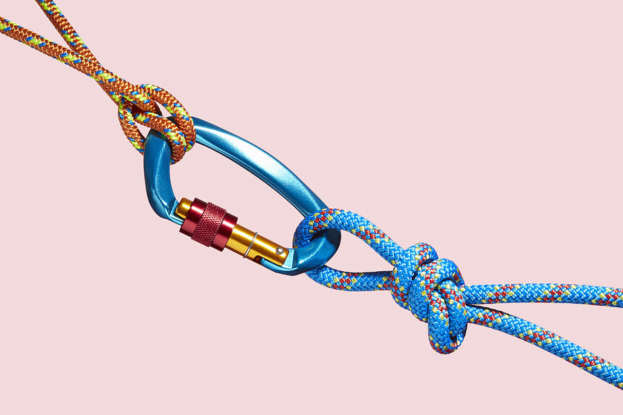 Two coloured ropes tied to a carabiner Photograph by Richard Drury