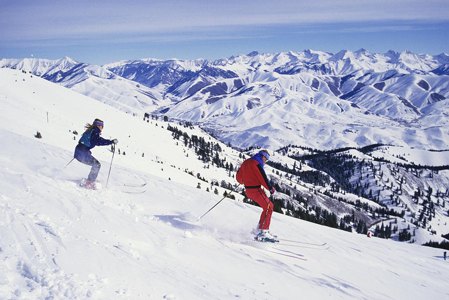 Two downhill skiers on slope, Sun Valley, Idaho, USA Photograph by Karl Weatherly