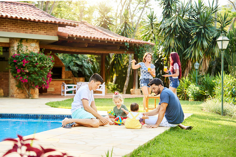 Two families enjoying holidays at a resort Photograph by AJ_Watt