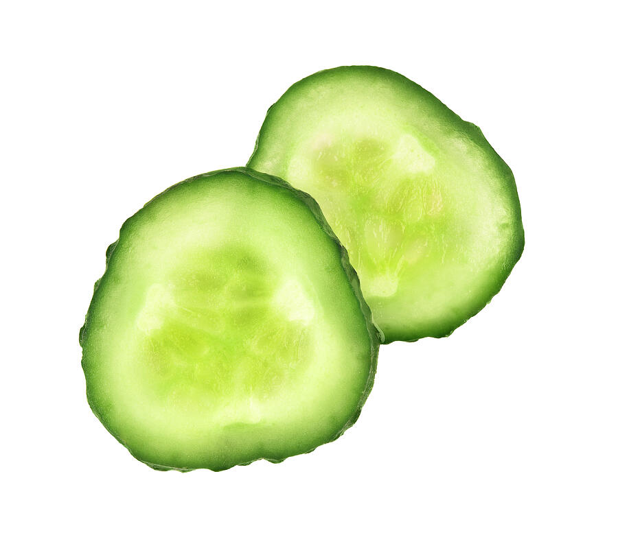 Two fresh slices of cucumber close-up isolated on white backgrou Photograph by Krafla