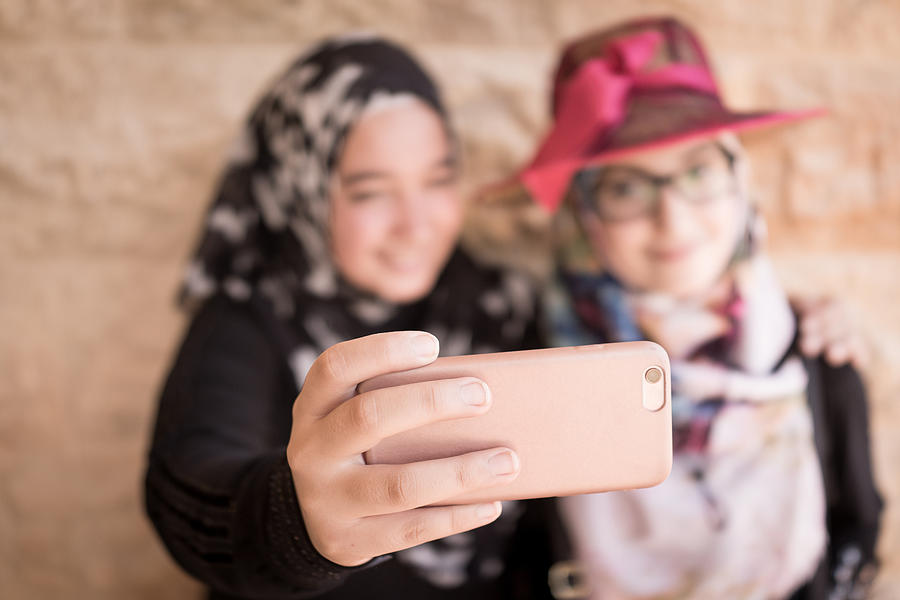 Two friendly girls making selfie Photograph by Jasmin Merdan