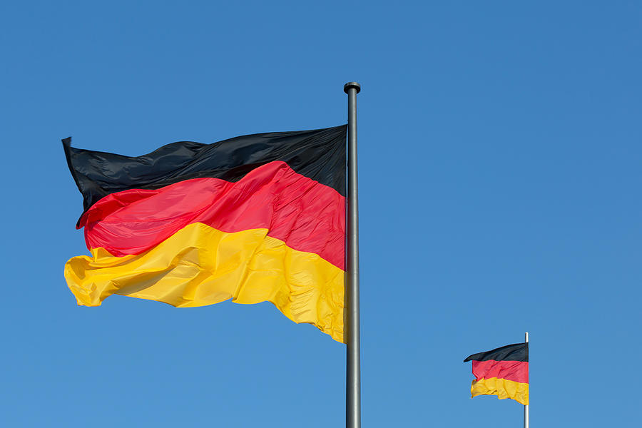 Two German flags with blue sky (Berlin, Germany) Photograph by Fhm