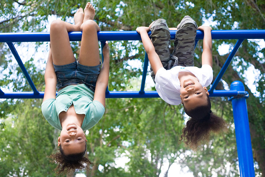 Two Girls Hanging Upside Down Photograph by Debibishop