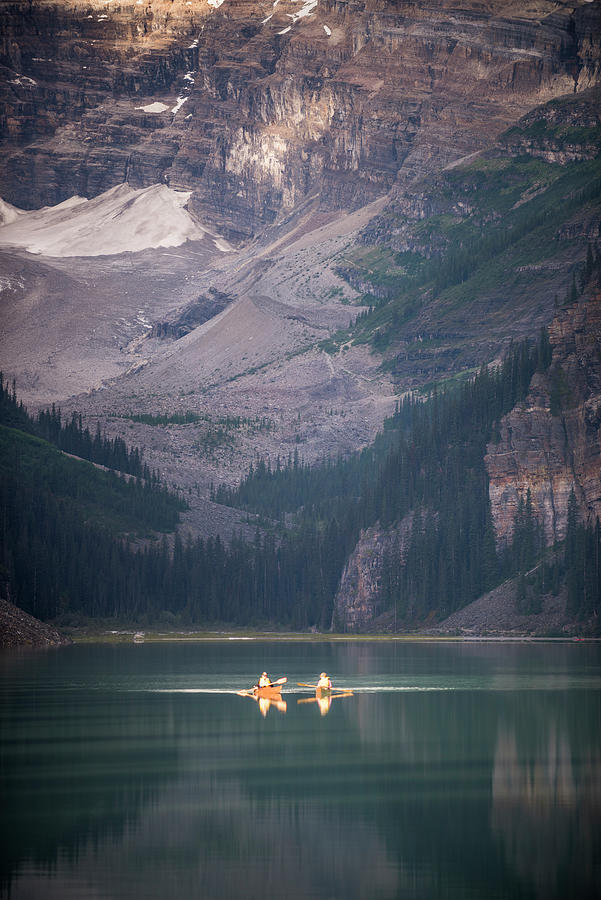 Two Glowing Kayaks Photograph by Bill Cubitt