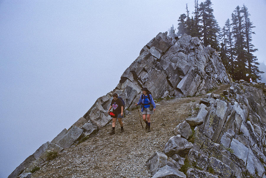 Two Hikers Walk the Pacific Crest Trail in Fog Photograph by JeffGoulden